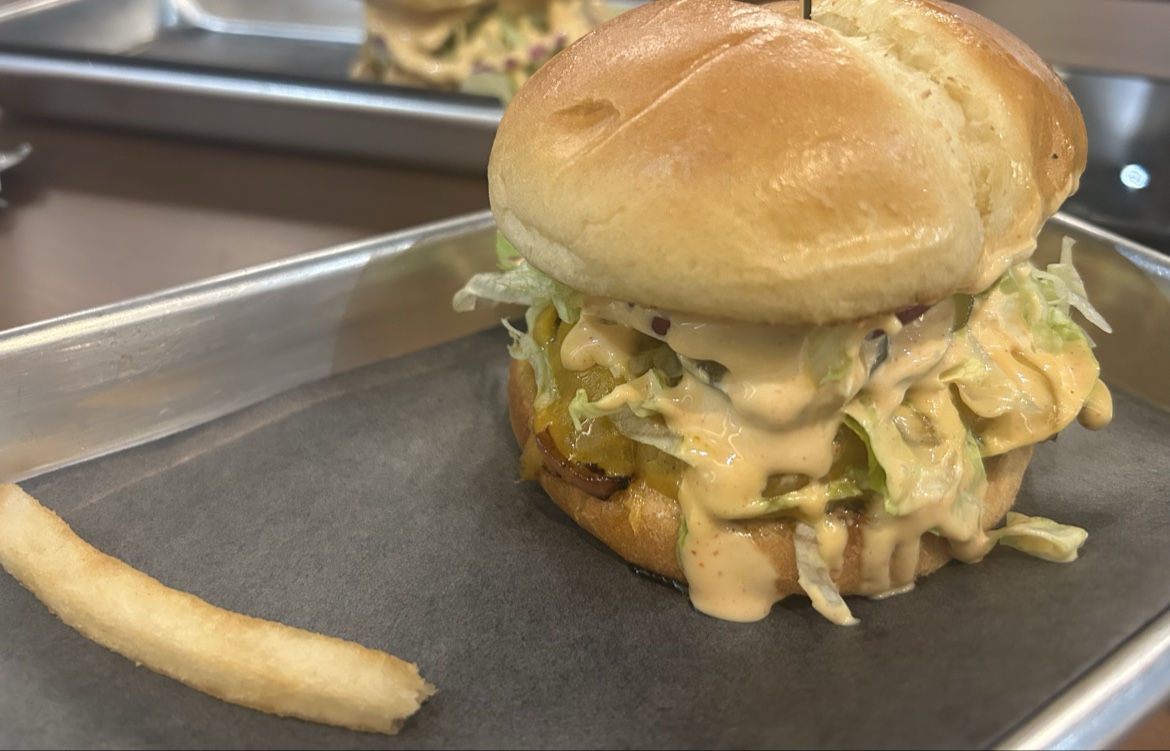 Saucy burger on a tray at Habibz Corner