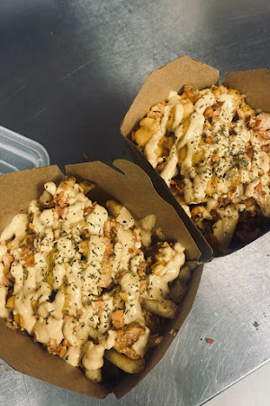 Two boxes of loaded fries at Habibz Corner
