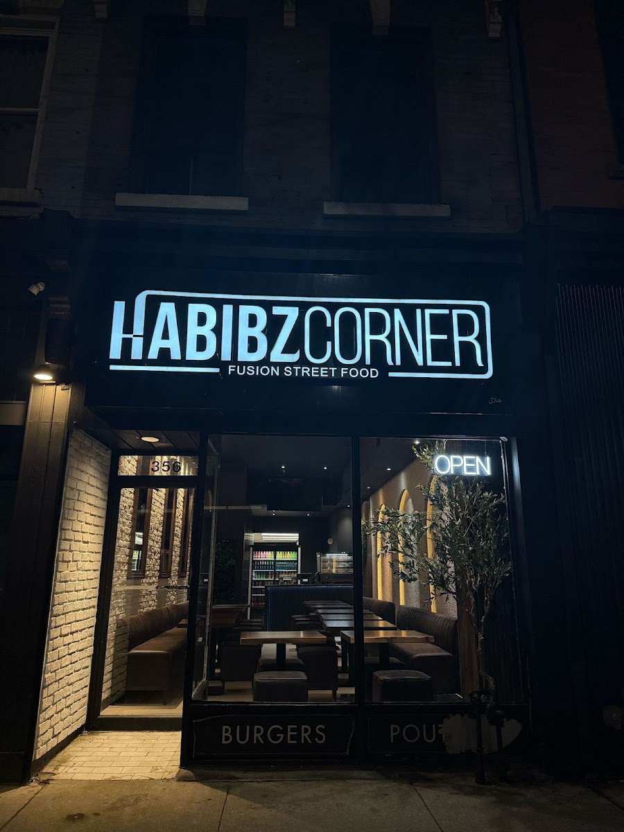 Habibz Corner storefront on Queen Street East at night