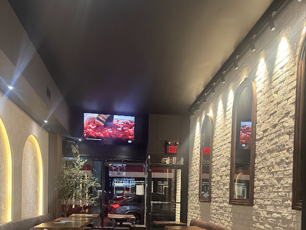 Habibz Corner brick wall interior with booth seating