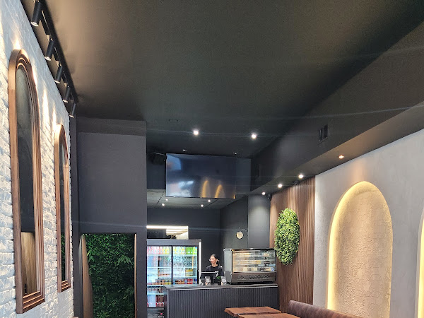 Habibz Corner counter area with modern lighting and decor